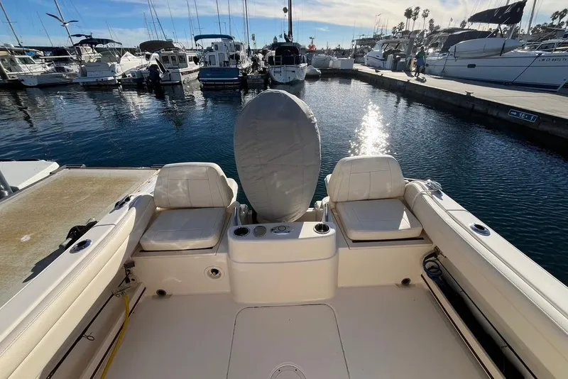 Slide: The Image of VHF marine radio on 2023 Grady-White Adventure 218 boat dashboard. - 19