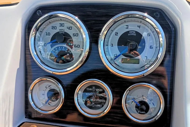 Slide: The Image of Dashboard gauges of a 2026 Starcraft SVX 211 OB boat, displaying speed and RPM. - 14