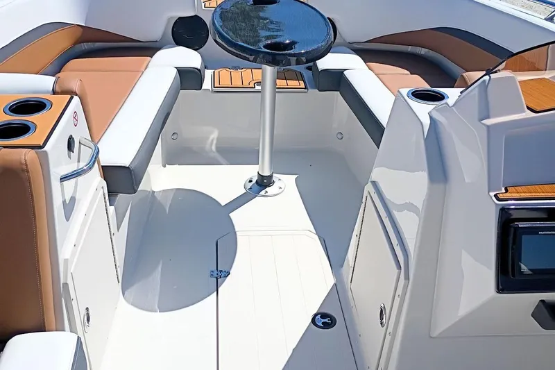 Slide: The Image of Interior of 2026 Starcraft SVX 211 OB boat with seating and table. - 19