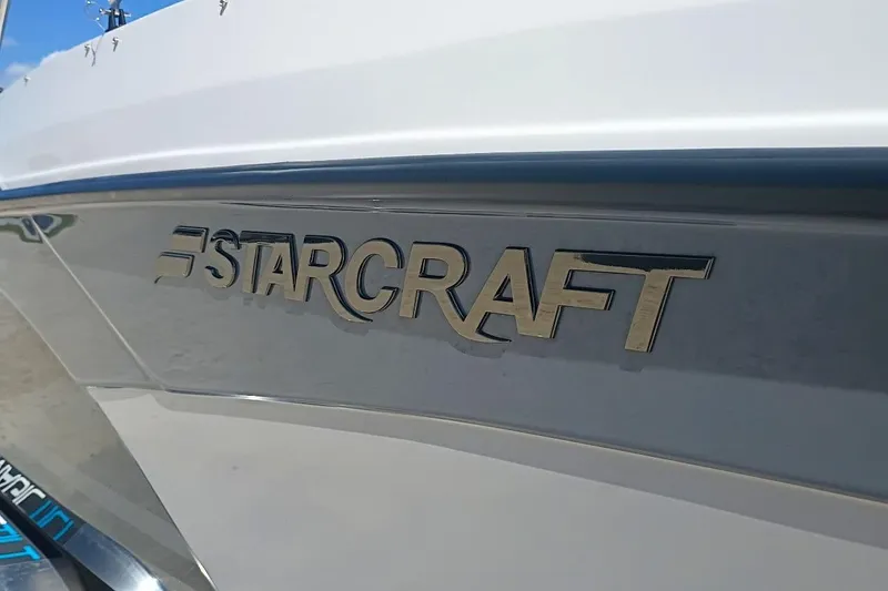 Slide: The Image of 2026 Starcraft SVX 211 OB boat logo on sleek white hull. - 23