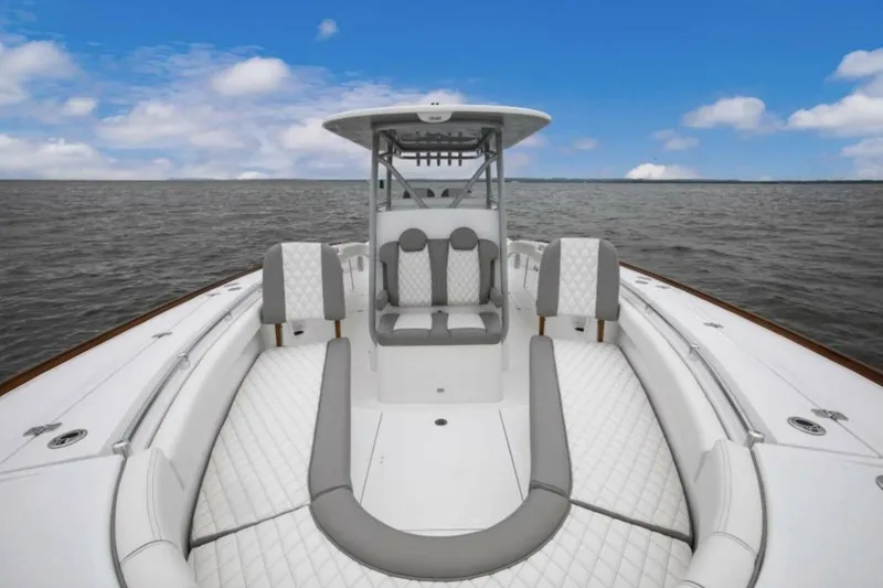 Slide: The Image of 2027 Buddy Davis Davis 34 boat with luxurious seating on open water. - 4
