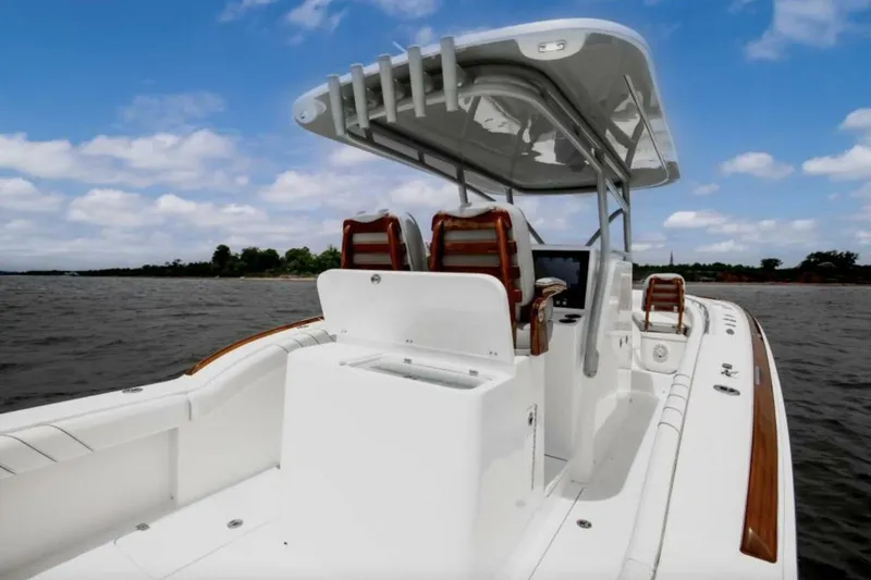 Slide: The Image of 2027 Buddy Davis Davis 34 boat on water, featuring sleek design and modern amenities. - 5