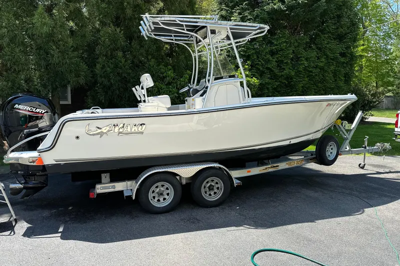 The Image of 2021 Mako 214 Center Console boat on trailer, parked outdoors. - 0