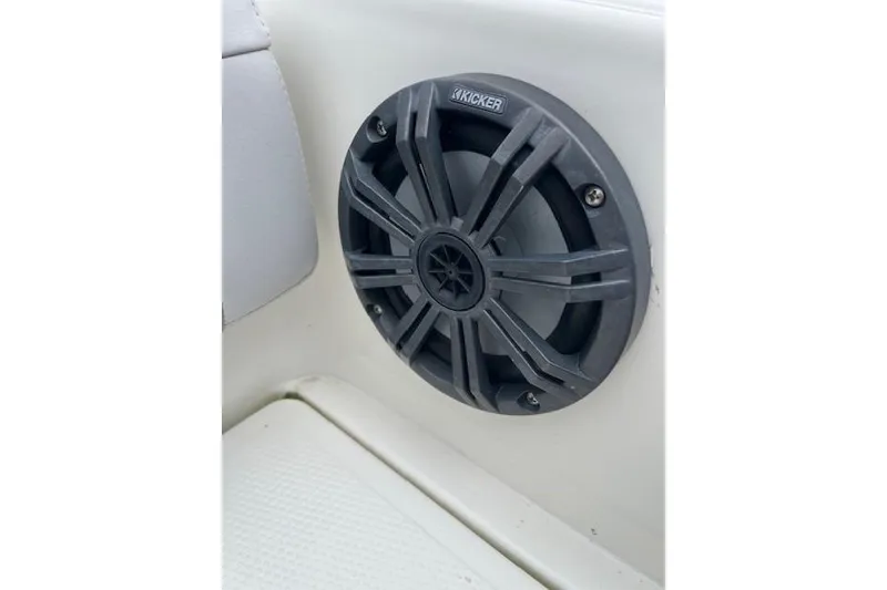 Slide: The Image of Kicker speaker on 2021 Mako 214 Center Console boat interior. - 86