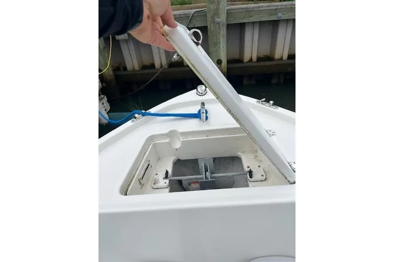 Slide: The Image of Open anchor compartment on 2021 Mako 214 Center Console boat. - 9
