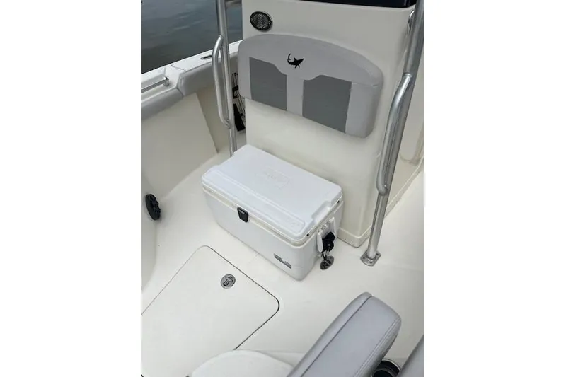 Slide: The Image of 2021 Mako 214 Center Console boat interior with white cooler and seating. - 91