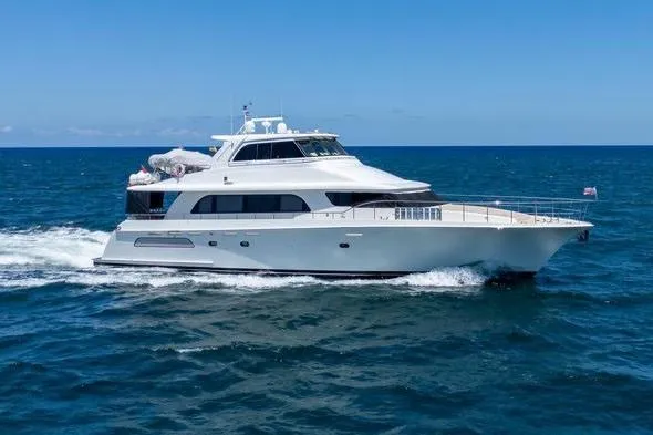 Slide: The Image of 2004 Cheoy Lee 81 Sport Yacht cruising on open sea under clear blue sky. - 1