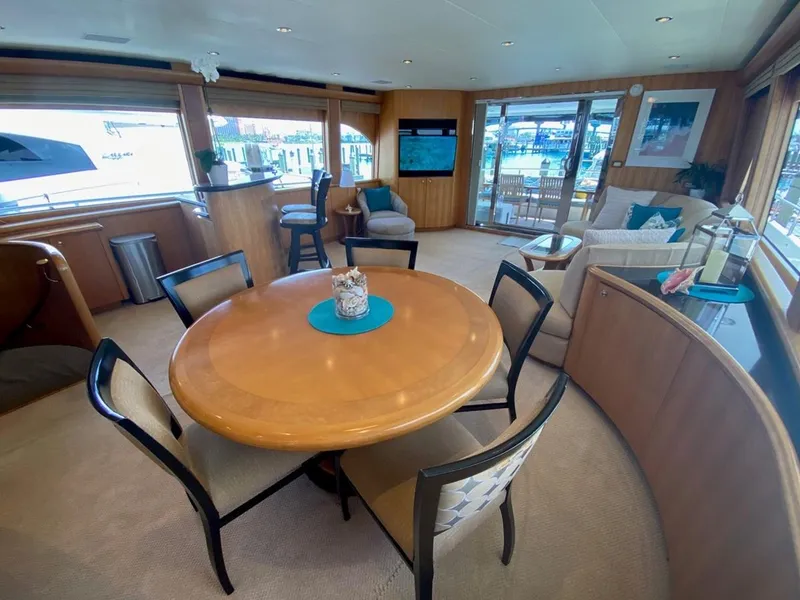 Slide: The Image of Luxurious interior of 2004 Cheoy Lee 81 Sport Yacht with elegant dining area and seating. - 10