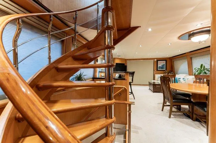 Slide: The Image of Luxurious interior of 2004 Cheoy Lee 81 Sport Yacht with elegant wooden staircase. - 13