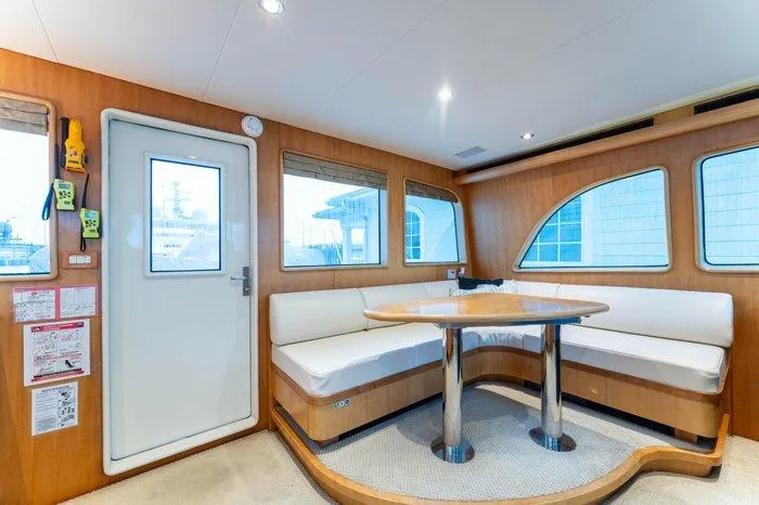 Slide: The Image of Interior of 2004 Cheoy Lee 81 Sport Yacht with cozy seating and dining area. - 14