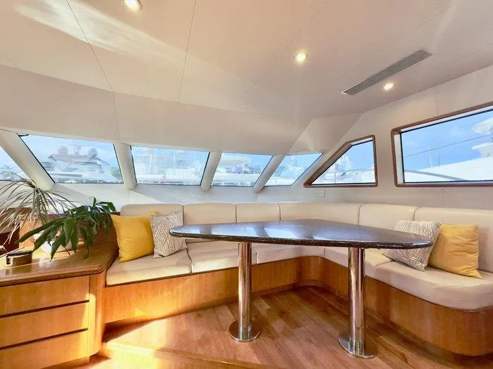 Slide: The Image of Luxurious interior of 2004 Cheoy Lee 81 Sport Yacht with elegant seating and panoramic windows. - 17