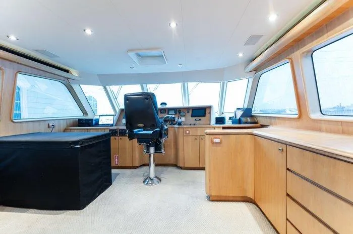 Slide: The Image of 2004 Cheoy Lee 81 Sport Yacht helm with modern controls and panoramic windows. - 19