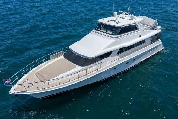 Slide: The Image of 2004 Cheoy Lee 81 Sport Yacht cruising on open water. - 2