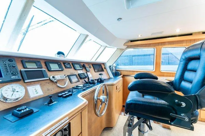 Slide: The Image of 2004 Cheoy Lee 81 Sport Yacht helm with navigation instruments and captain's chair. - 20