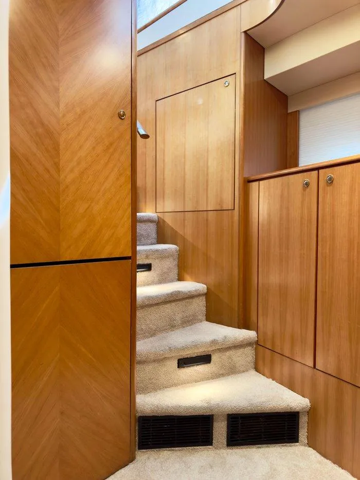 Slide: The Image of Interior staircase of 2004 Cheoy Lee 81 Sport Yacht with wooden paneling. - 22