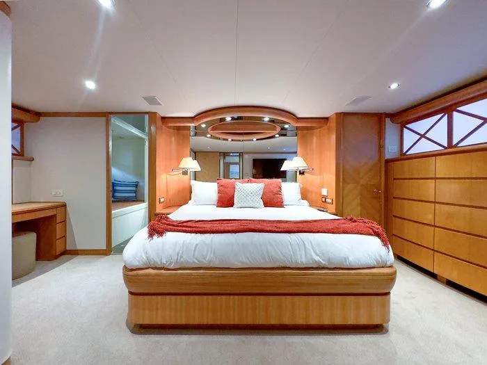 Slide: The Image of Luxurious bedroom interior of 2004 Cheoy Lee 81 Sport Yacht with elegant wood finishes. - 23