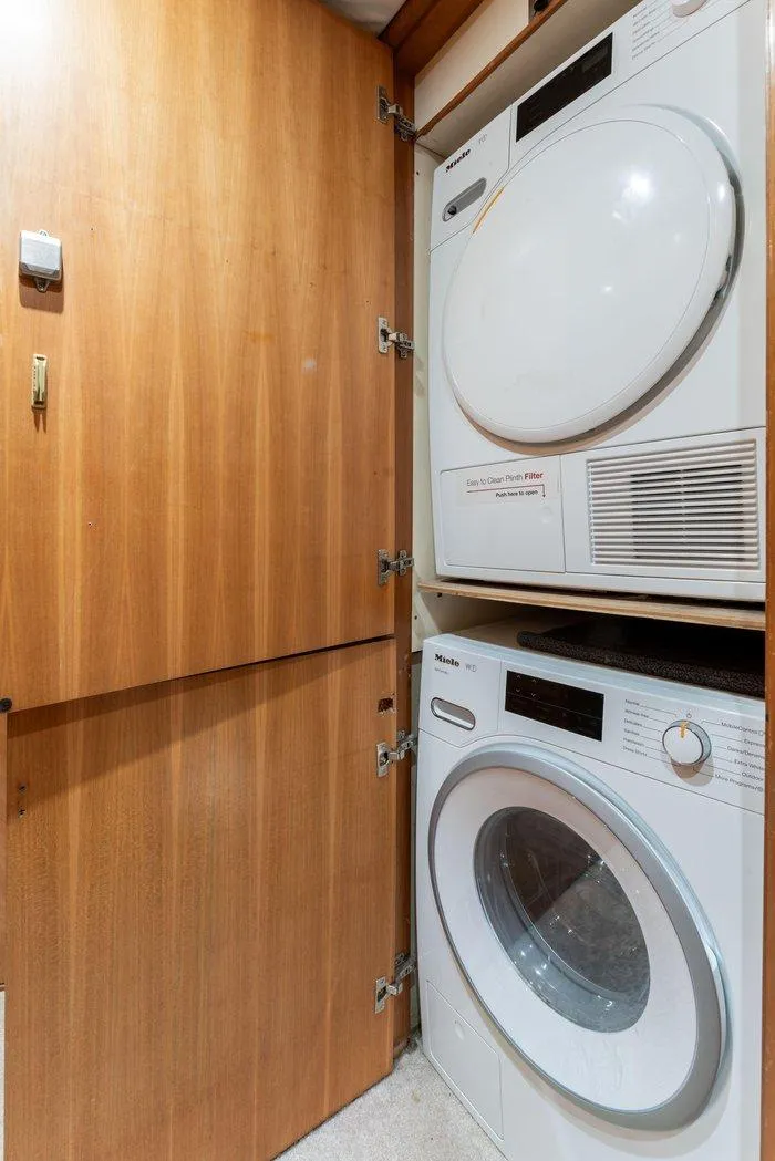 Slide: The Image of Stacked washer and dryer in 2004 Cheoy Lee 81 Sport Yacht laundry area. - 27