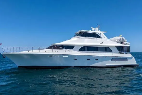 Slide: The Image of 2004 Cheoy Lee 81 Sport Yacht cruising on open water under clear blue skies. - 3