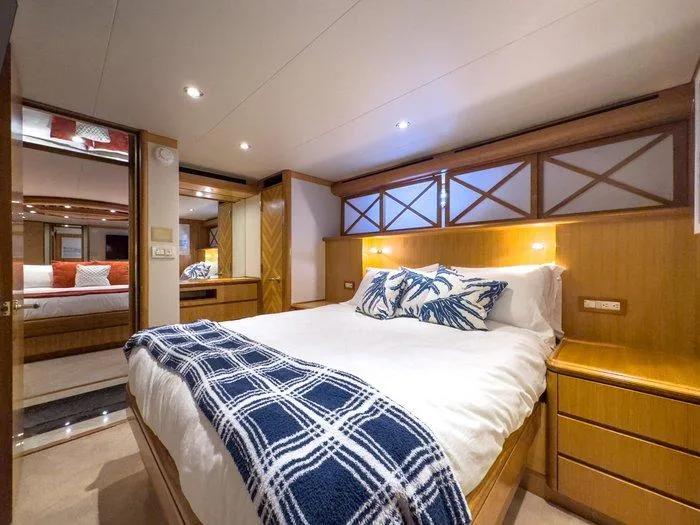 Slide: The Image of Luxurious bedroom interior of 2004 Cheoy Lee 81 Sport Yacht with elegant bedding and wood accents. - 30