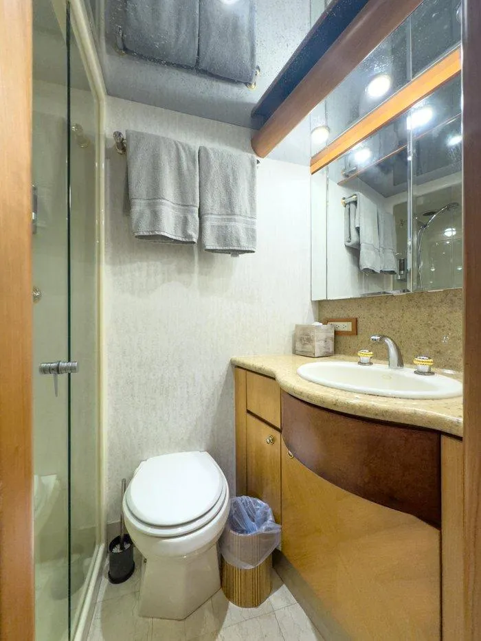 Slide: The Image of Luxurious bathroom in 2004 Cheoy Lee 81 Sport Yacht with modern fixtures and glass shower. - 34