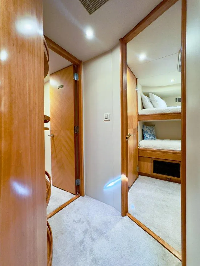 Slide: The Image of Interior of 2004 Cheoy Lee 81 Sport Yacht with cozy wooden finish and bunk beds. - 35