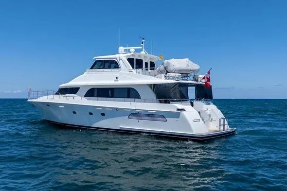 Slide: The Image of 2004 Cheoy Lee 81 Sport Yacht cruising on open sea under clear blue sky. - 38