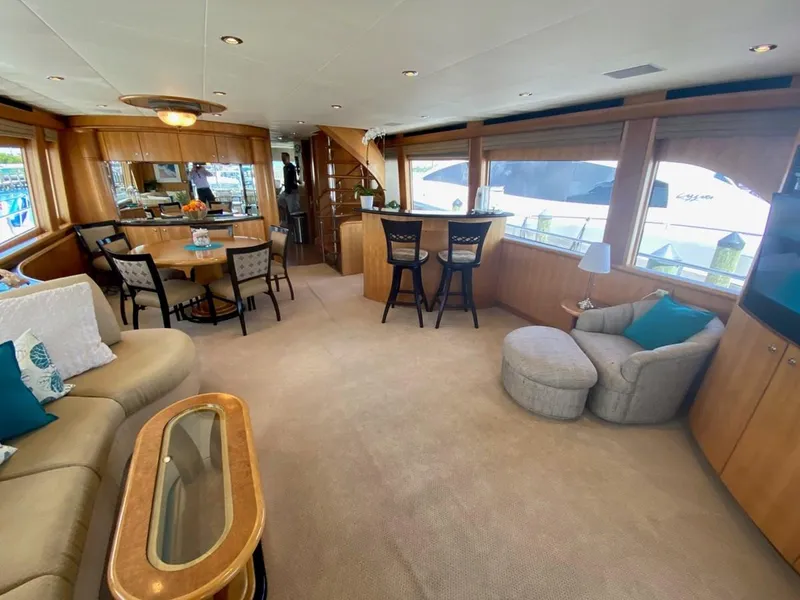 Slide: The Image of Luxurious interior of 2004 Cheoy Lee 81 Sport Yacht with elegant seating and dining area. - 8