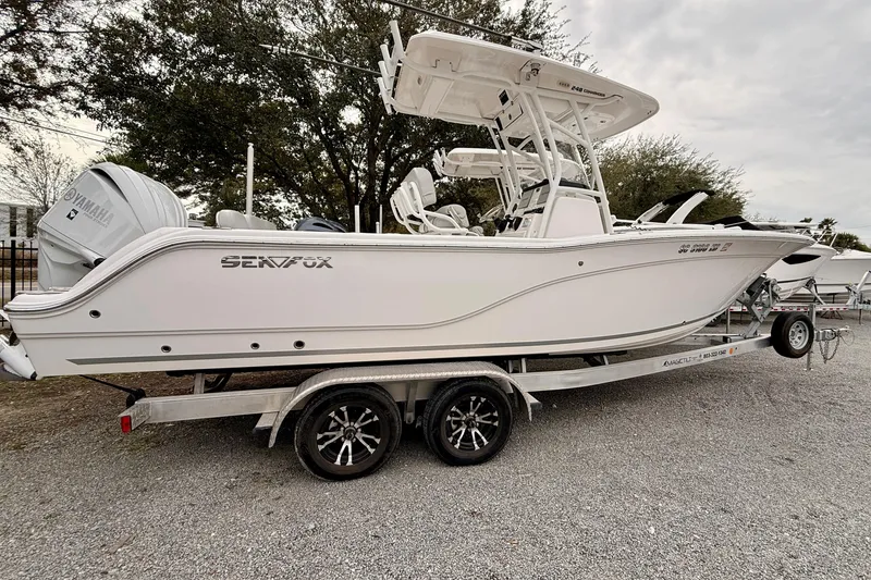 Slide: The Image of 2023 Sea Fox 248 Commander boat on trailer, side view, outdoors. - 13