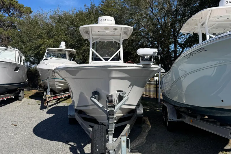 Slide: The Image of 2023 Sea Fox 248 Commander boat on trailer, surrounded by other boats. - 14
