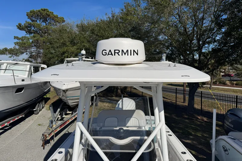 Slide: The Image of 2023 Sea Fox 248 Commander boat with Garmin radar, parked outdoors. - 15