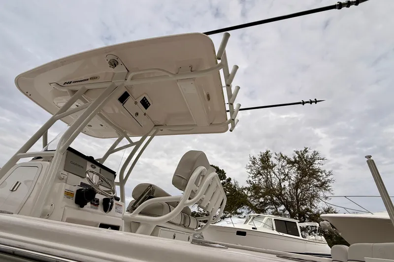 Slide: The Image of 2023 Sea Fox 248 Commander boat console with T-top and fishing rods. - 16