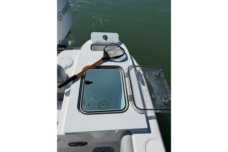 Slide: The Image of 2023 Sea Fox 248 Commander boat deck with fishing net and open hatch. - 22