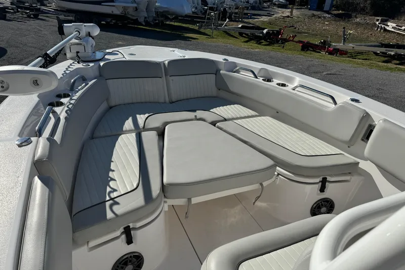 Slide: The Image of 2023 Sea Fox 248 Commander boat interior with cushioned seating and cup holders. - 29