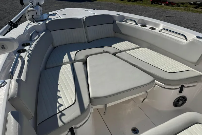 Slide: The Image of 2023 Sea Fox 248 Commander boat interior with cushioned seating and cup holders. - 31