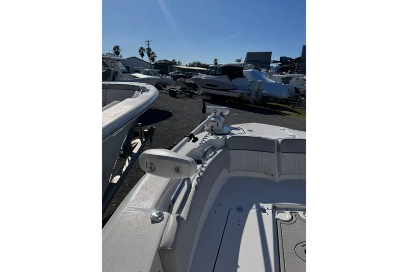 Slide: The Image of 2023 Sea Fox 248 Commander boat in a marina, surrounded by other vessels. - 32