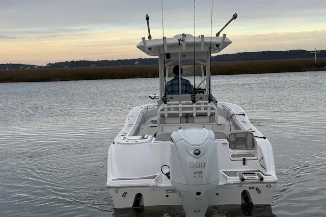 Slide: The Image of 2023 Sea Fox 248 Commander boat on calm water at sunset. - 4