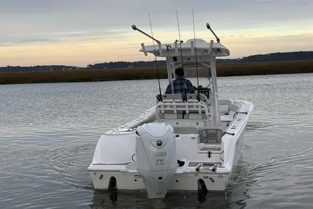 Slide: The Image of 2023 Sea Fox 248 Commander boat navigating calm waters at sunset. - 5