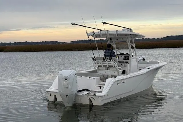 Slide: The Image of 2023 Sea Fox 248 Commander boat on calm water, equipped for fishing. - 6