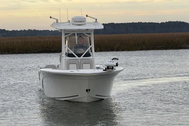 Slide: The Image of 2023 Sea Fox 248 Commander boat navigating calm waters at sunset. - 8