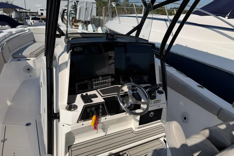 Slide: The Image of 2020 Sea Fox 328 Commander boat cockpit with modern controls and steering wheel. - 11