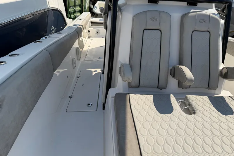 Slide: The Image of 2020 Sea Fox 328 Commander boat interior with cushioned seating and armrests. - 13