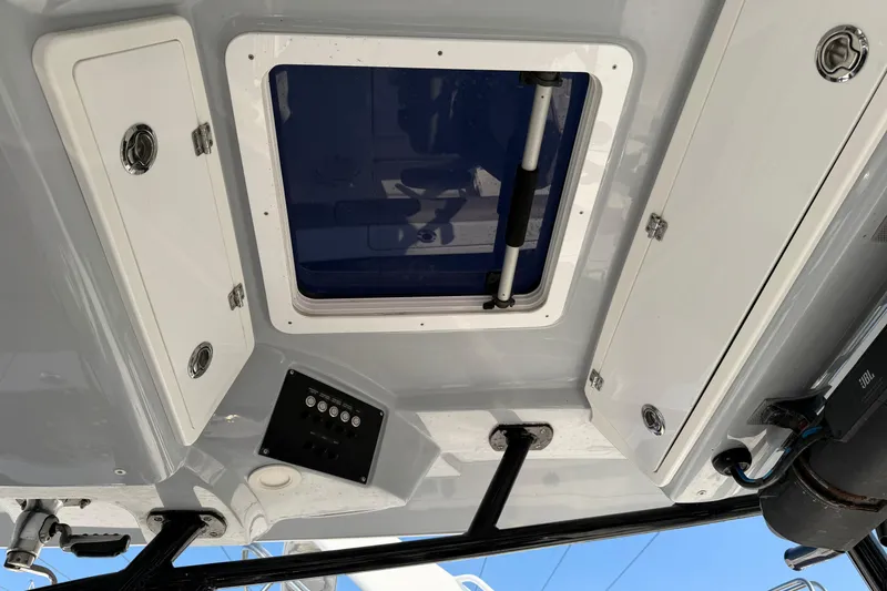 Slide: The Image of 2020 Sea Fox 328 Commander boat interior with storage compartments and control panel. - 18