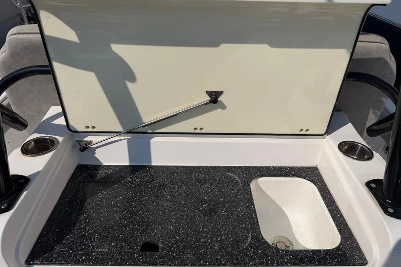 Slide: The Image of 2020 Sea Fox 328 Commander boat interior with storage compartment and sink. - 19