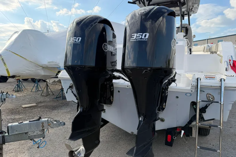 Slide: The Image of 2020 Sea Fox 328 Commander with twin Yamaha 350 outboard engines, docked outdoors. - 3