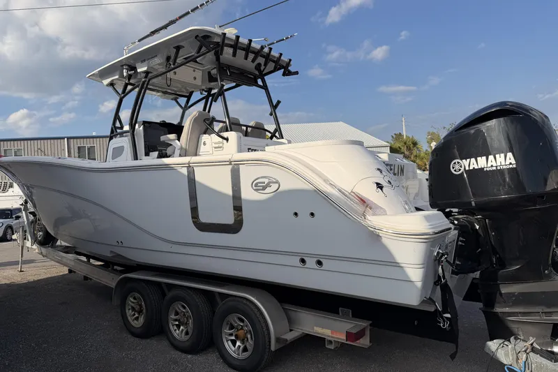 Slide: The Image of 2020 Sea Fox 328 Commander boat on trailer with Yamaha engine, parked outdoors. - 5