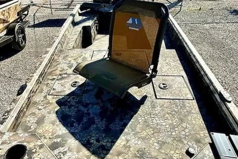 Slide: The Image of 2026 Thor Fish Hammer 1754 LR boat with camouflage design and central seating. - 5