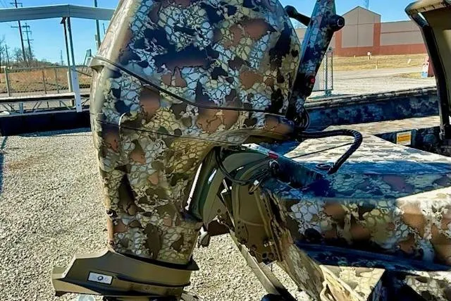 Slide: The Image of Camouflage-patterned 2026 Thor Fish Hammer 1754 LR outboard motor in a sunny outdoor setting. - 7
