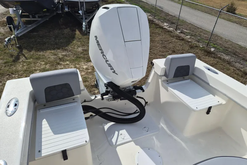 Slide: The Image of 2026 May-Craft 238 CC boat with Mercury outboard engine, featuring dual seating. - 4