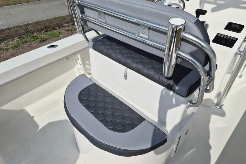 Slide: The Image of 2026 May-Craft 238 CC boat seating with sleek gray upholstery and stainless steel railings. - 5