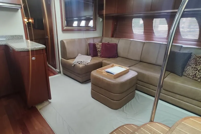 Slide: The Image of Luxurious interior of 2006 Sea Ray 48 Sundancer yacht with plush seating and elegant decor. - 11